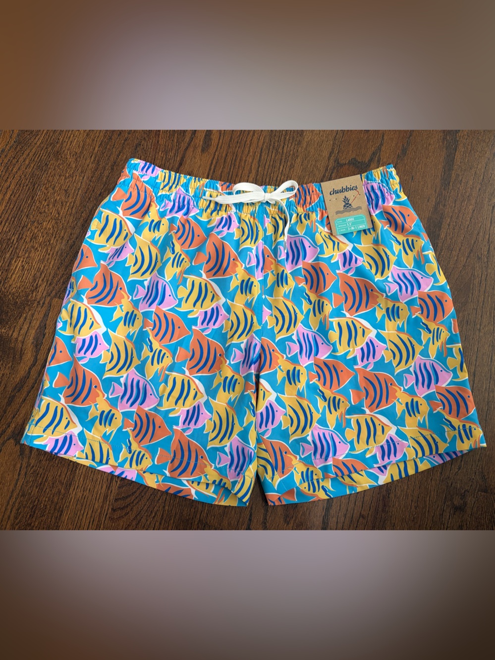 chubbies Tropical Fish Print Swim Trunks in Teal, Orange, Yellow, Pink